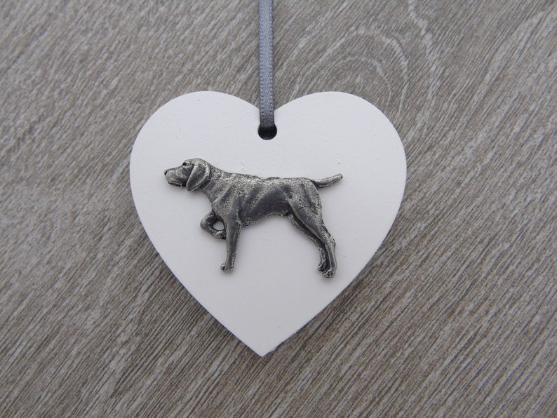 May include: White heart-shaped wooden ornament with a pewter German Shorthaired Pointer dog figurine.