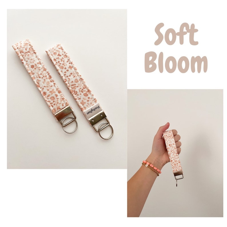 May include: Two white and peach keychains with a floral pattern and the text "Peachylove" on the back. The keychains are attached to silver key rings. The text "Soft Bloom" is written in a large font on a white background.