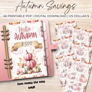 Może przedstawiać: Różowy planer z napisem "Hello Autumn" i "$500" na okładce, z ilustracjami dyni. Obraz zawiera również wkładki do śledzenia oszczędności z różnymi kwotami i tekstem "Autumn Savings". Obecna jest również fraza "Save money the easy way!!".
