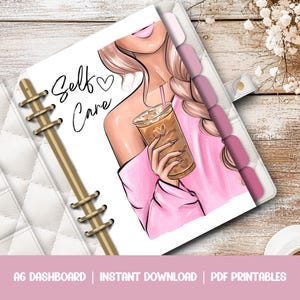 May include: A white A6 planner with a pink and white illustration of a woman holding a cup of iced coffee. The text "Self Care" is written in black cursive on the planner.