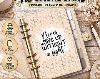 May include: An A6 planner dashboard featuring a beige background with a gold hexagonal pattern and the black text Never give up WITHOUT a fight. The dashboard is inside a ring binder with gold rings, accompanied by three gold circular icons.