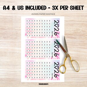 May include: A printed sheet with three 2026 budget trackers, each with a floral design and the text "Total: 1560". The text "A4 & US INCLUDED - 3X PER SHEET" is at the top. Gold scissors are on the right.