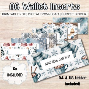 May include: A6 wallet inserts with winter-themed designs. The inserts feature illustrations of mittens, snowflakes, hot cocoa, and winter hats. The text "Write your own text" is visible on one insert. The image also includes the text "6x Included" and "A4 & US Letter Included!"