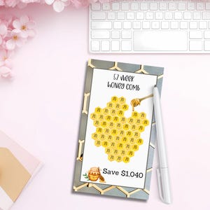 May include: A printable 52-week savings challenge chart with a honeycomb design. The chart is titled "52 week honey comb" and includes the text "Save $1,040".