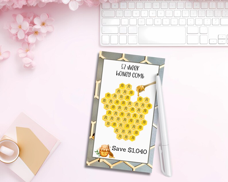 May include: A printable 52-week savings challenge chart with a honeycomb design. The chart is titled "52 week honey comb" and includes the text "Save $1,040".