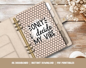 May include: A pink and black planner with a honeycomb pattern and the text "ONLY i decide MY VIBE" in black.