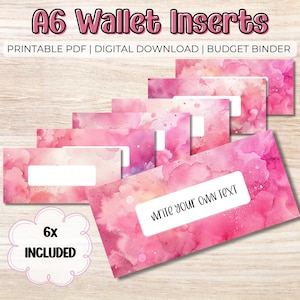 May include: Six pink watercolor A6 wallet inserts with a white label for writing. The label on one insert says "write your own text".