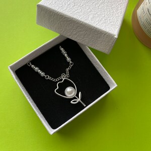 Silver-Plated Necklace with Flower Pendant and Pearl Accent | Fashion Jewelry