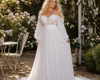 May include: A floor-length white wedding dress featuring an off-the-shoulder neckline, long sheer bishop sleeves, and a bodice with intricate lace detailing. The dress has a fitted waistline and a flowing skirt that extends into a train.