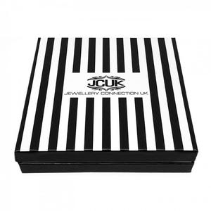May include: A black and white striped box with the text "JCUk Jewellery Connection UK" in a white rectangle. The box is rectangular and has a black base.