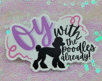 May include: A white sticker with a purple and pink design that says "Over the Poodles Already!" with a black silhouette of a poodle in the middle.