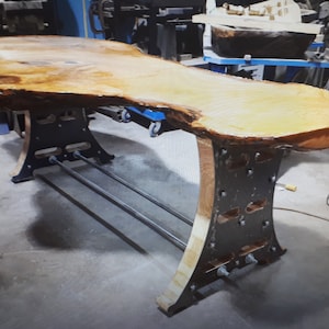 Custom live edge dining table with metal legs and epoxy finish