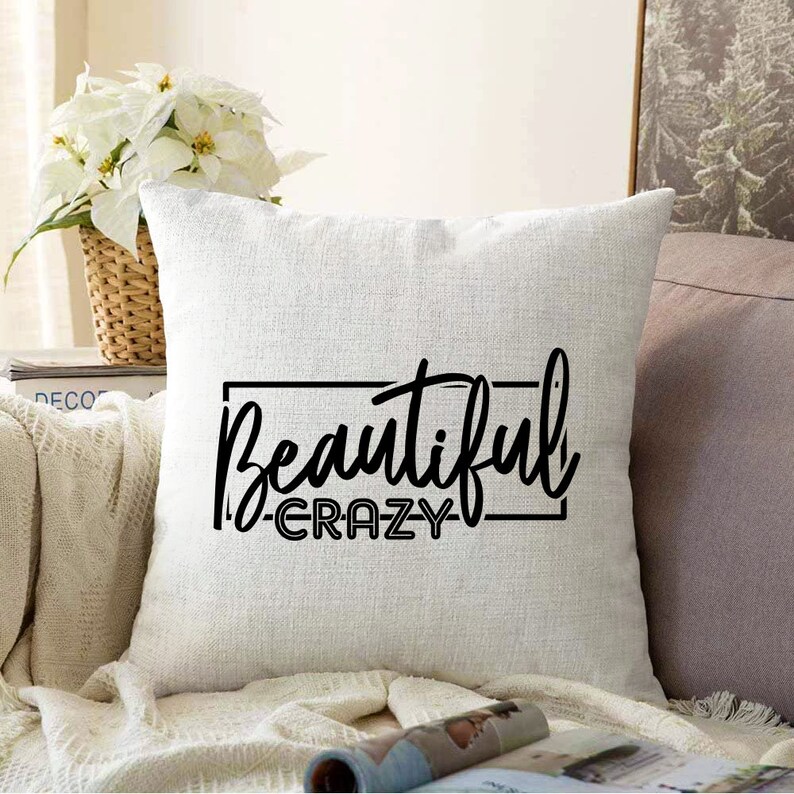 May include: White throw pillow with black text that reads "Beautiful -Crazy-" in a decorative font.