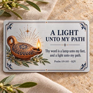 May include: A rectangular metal sign with a brushed silver finish featuring an illustration of a lit oil lamp surrounded by olive branches. The text reads A LIGHT UNTO MY PATH, Thy word is a lamp unto my feet, and a light unto my path. Psalm 119:105 KJV.
