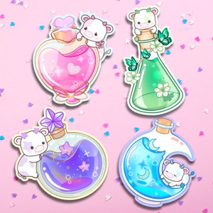 May include: Four colorful glass bottles with cow charms and glitter inside. The bottles are shaped like hearts, beakers, and moons. The bottles are on a pink background with white confetti.