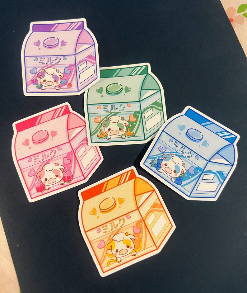 May include: Five colorful milk carton stickers with a cartoon cow and the Japanese word "milk" on each. The stickers are on a dark blue background.