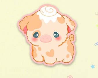 May include: A cartoon pig with a swirl of white frosting on its head. The pig is light brown with pink cheeks and has sparkly blue eyes. The pig is sitting on a pink background.