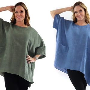 May include: Two women wearing loose-fitting linen tops with a single pocket on the front. The top on the left is a muted green color, and the top on the right is a light blue color.