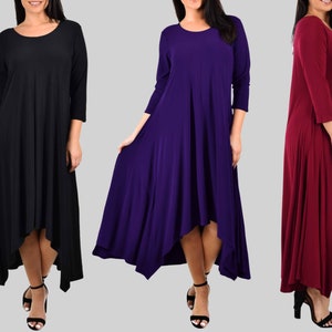 May include: Three long-sleeved dresses in black, purple, and burgundy. The dresses have a high-low hemline and a relaxed fit.