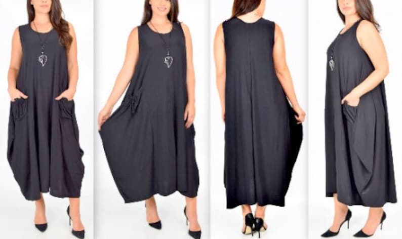 May include: A black sleeveless maxi dress with two large pockets on the front and a simple design. The dress is flowy and has a relaxed fit.