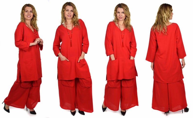 May include: A red tunic top with long sleeves and two pockets, paired with wide-legged pants. The outfit is made of a soft, flowing fabric.