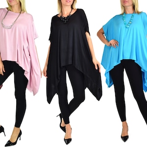 May include: Three tunics in pink, black, and turquoise. Each tunic has a unique asymmetrical hemline and short sleeves. The tunics are paired with black leggings. Accessories include necklaces and black heels.