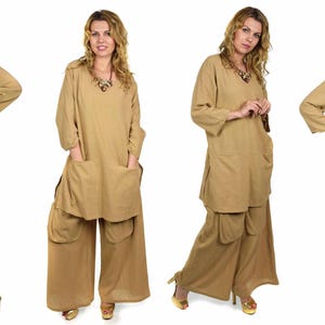 May include: A set of four photos showing a woman wearing a long, loose-fitting, tan tunic top with pockets and matching wide-leg pants. The top has a V-neckline and three-quarter sleeves. The pants have a wide, flowing leg and are cinched at the waist.
