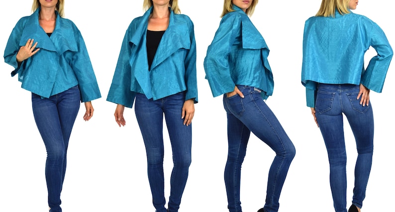 May include: A turquoise blue jacket with a draped collar and long sleeves. The jacket is made of a silky fabric and has a relaxed fit.