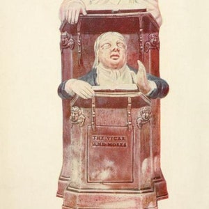 May include: A brown ceramic figurine titled The Vicar and Moses, depicting a person sleeping in a high-backed chair above a pulpit where another person stands with one hand raised. The base features the text The Vicar and Moses, Ralph Wood, 1750.