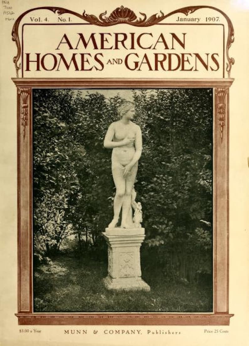 May include: A black and white magazine cover with the title "AMERICAN HOMES AND GARDENS" in a decorative font. The cover features a black and white photograph of a white marble statue of a woman standing on a pedestal in a garden.