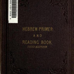May include: A dark brown hardcover book titled HEBREW PRIMER AND READING BOOK. THIRD EDITION in gold lettering. The cover features a textured leather-like surface with embossed floral corner details and a white barcode label in the top left corner.