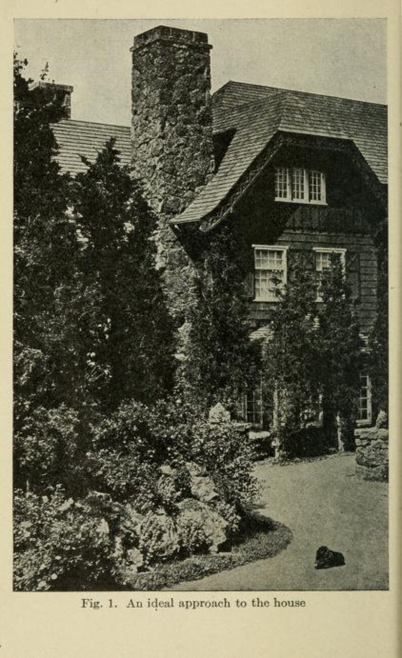 May include: A black and white photo of a house with a stone chimney and a path leading up to the front door. The house has a gabled roof and several windows. There are trees and bushes surrounding the house.