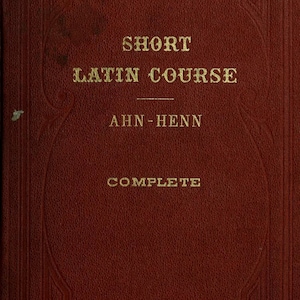 May include: A dark red hardcover book with gold embossed text on the front cover. The title reads SHORT LATIN COURSE, followed by the authors AHN-HENN, and the word COMPLETE at the bottom. The cover features a decorative border frame design.