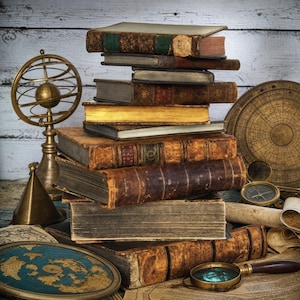May include: A stack of antique, leather-bound books with weathered spines and worn edges. Beside the books are a brass armillary sphere, a circular star chart, a magnifying glass with a wooden handle, and a flat, circular map of the world.