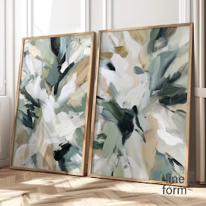 以下が含まれることがあります： 2つの額入り抽象芸術プリント。アートワークは、白、緑、ベージュ、黒の色合いの筆致を特徴としています。フレームは明るい色の木材で作られています。右側のプリントの右下隅には「Nine form」というテキストがあります。