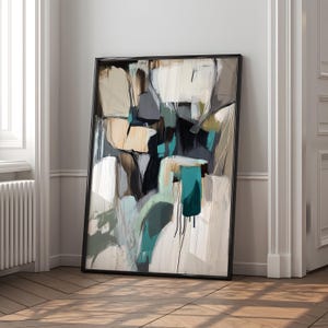 May include: Abstract painting with a black frame. The painting features a mix of white, gray, brown, and teal colors in a geometric pattern.