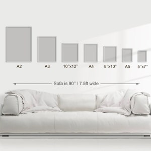 May include: A white sofa with a 90-inch width, shown with different sizes of picture frames. The frames are labeled with their dimensions: A2, A3, 10"x12", A4, 8"x10", A5, and 5"x7".