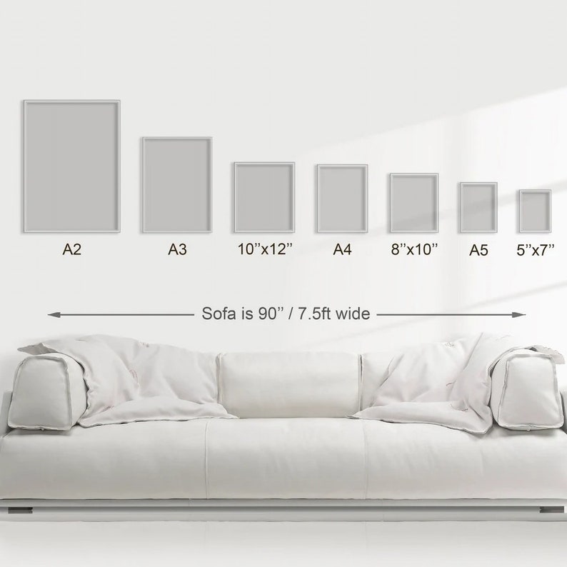 May include: A white sofa with a 90-inch width, shown with different sizes of picture frames. The frames are labeled with their dimensions: A2, A3, 10"x12", A4, 8"x10", A5, and 5"x7".