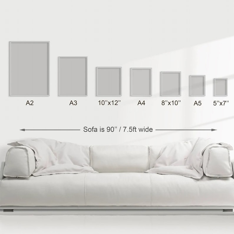 May include: A white sofa with a 90-inch width, shown with different sizes of picture frames. The frames are labeled with their dimensions: A2, A3, 10"x12", A4, 8"x10", A5, and 5"x7".