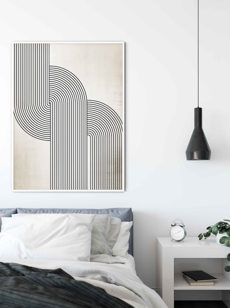 May include: A black and white abstract geometric print with a beige background. The print features a series of vertical lines and curved lines that create a modern and minimalist design.