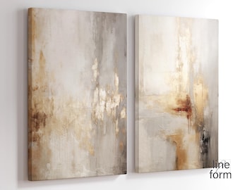 May include: Two abstract paintings in a set. The paintings are on canvas and feature a light gray background with gold and brown accents. The paintings are rectangular and have a modern style.