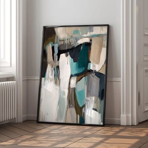 May include: Abstract painting with a black frame. The painting features a mix of teal, white, brown, and gray colors in a geometric pattern.