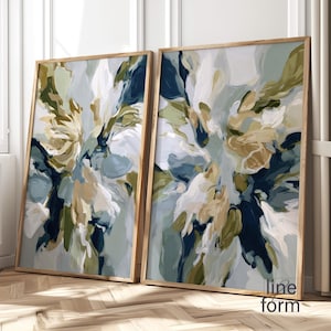 Pode incluir: Duas impressões de arte abstrata emolduradas. A obra apresenta um design floral com pinceladas em tons de branco, azul marinho, verde oliva e bege. As molduras são de madeira clara. O texto "line form" é visível no canto inferior direito.
