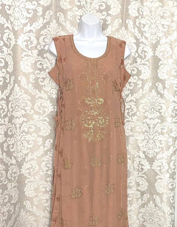 Beautiful double layered georgette one piece suit with heavy Swarovski work & Criss Criss Doris