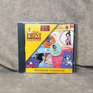 May include: A Disney's Print Studio CD-ROM featuring the movie Mulan. The cover is yellow and black with images of characters from the film. The text "PROGRAM HANDBOOK" is visible.