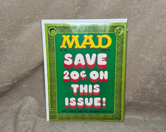 May include: A green and red magazine cover with the title "MAD" and the text "SAVE 20¢ ON THIS ISSUE!" The cover also includes the issue number "NO. 237" and the date "MAR. 83".