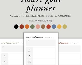 May include: A printable smart goal planner with a minimalist design. The text includes "smart goal planner" and "instant download pdf." The color palette includes black, brown, orange, green, pink, and other colors. The planner is available in A4, A5, and letter sizes.