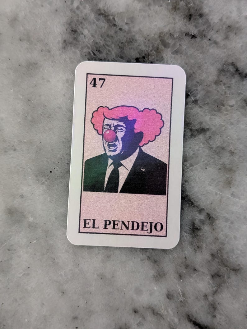 May include: A rectangular sticker featuring a caricature of a man with pink clown hair and a red nose. The number 47 is in the top left corner. The text "EL PENDEJO" is at the bottom.