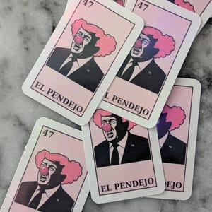 May include: A collection of rectangular cards featuring a caricature of a man with a clown nose and pink hair. The cards have the number "47" in the top corner and the words "EL PENDEJO" at the bottom.