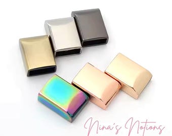 May include: Assortment of metal slider buckles in various finishes, including gold, silver, rose gold, black, and iridescent. These buckles are great for adding a touch of style to your jewelry, bags, or other crafts.